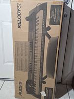Front of sealed Alesis Melody 61 MKII box