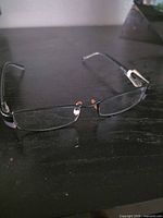 Full view of Prada eyeglass frames on table