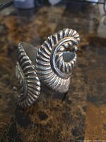 Front view showing ridged swirl design of sterling cuff bracelet
