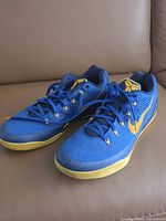 Top view of both shoes showing colorway, Kobe logos, engineered mesh uppers and laces