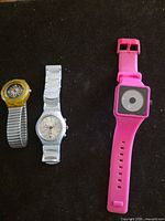 All three watches side by side showing fronts and straps