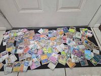 Wide shot of entire spread of Pokémon cards on floor mat