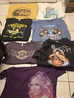 All seven t-shirts laid out for overview