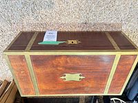 Closed chest showing brass banding and escutcheon