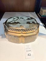 Overall view of brass/bronze decorative box with lid closed