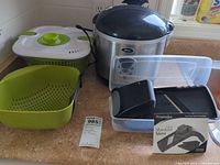Lot overview: rice cooker, salad spinner parts, mandoline slicer with box, clear storage container