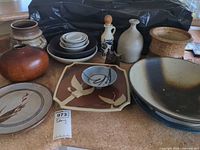 Group shot showing all 14 stoneware pieces on countertop