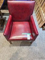 Front view of burgundy faux leather chair