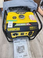 Front view of Champion generator with cover and manual packet