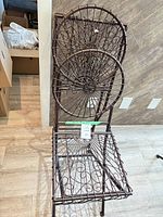 Full view of first wrought iron folding chair