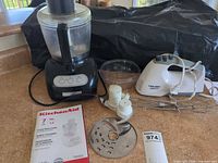 KitchenAid food processor with bowl, lid, disc, blade, stem, pusher, manual; Black & Decker hand mixer with beaters
