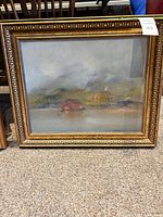 Front view of framed landscape oil painting