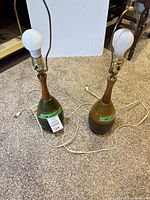 Both lamps standing side by side with cords and bulbs visible