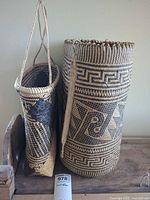 Front view of both woven baskets showing patterns and shape