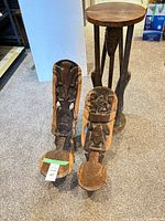 All three carved wooden stools grouped