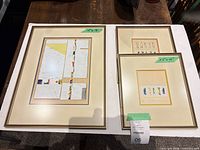 All three framed prints laid out showing relative sizes and frames