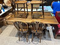 table top with chairs placed upside down for viewing