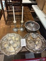 Overall lot showing candlesticks, trays, covered bowl and cups