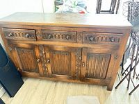 Front view showing entire oak sideboard