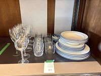 Overall lot showing plates, bowls, wine glasses, tumblers