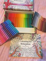 Open box showing 60 connector markers and colouring book