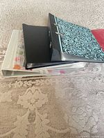 Stack of binders and snap folders