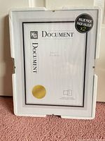Front view of packaged document frames showing size and value pack label