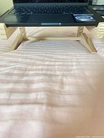 Laptop on assembled wooden stand