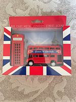 Front view of boxed set showing bus and telephone box sharpeners