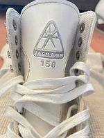 Close-up of Jackson 150 tongue logo and lacing