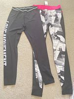 Two pairs of leggings laid flat