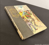 Front cover showing title "Dickens Christmas Carol" and cloth spine wear