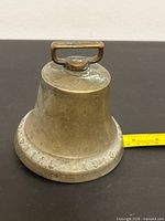 Bell side view with measuring tape for diameter reference