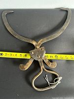 Full view of tongs fully open with tape measure showing length