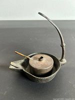 Full view of oil lamp with burner and handle