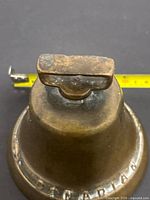 Top view showing handle and patina on brass bell