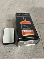 Front view showing label and lid