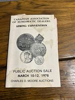 Front cover showing title, coin images, stains