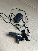 Rear view of GPS unit with cable and mount