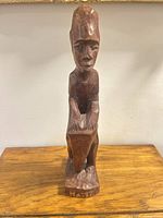 Front view showing full figure and HAITI inscription