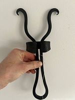 Front view showing overall form and black finish