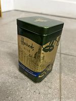 Front angled view of Harrods tea tin showing label and artwork