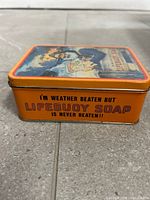 Side view showing slogan and orange finish