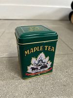 Front view of green Maple Tea tin