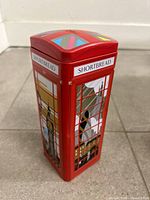 Front view of red telephone-box style tin with landmark graphics and SHORTBREAD label