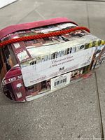 Back label showing brand, product info and Paris café artwork