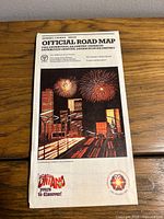 Front cover of folded Ontario road map showing title, fireworks illustration, bicentennial emblem