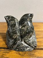 Front view of twin-bird soapstone sculpture