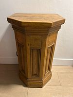 Front view of hexagonal solid wood cabinet pedestal