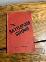 Front cover of red paperback showing title and author